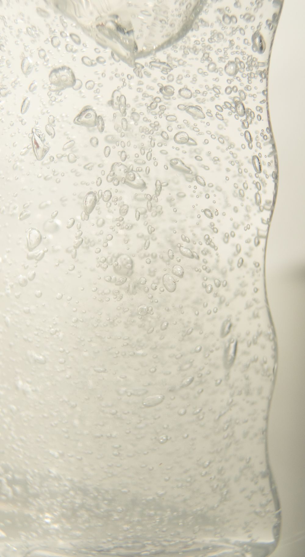 Bubbles rising in a glass of sparkling water